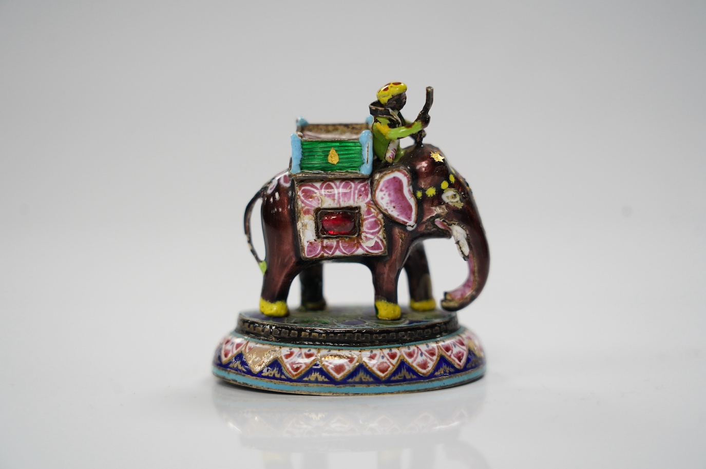 An Indian enamelled white metal elephant and mahout, 5cm. Condition - good